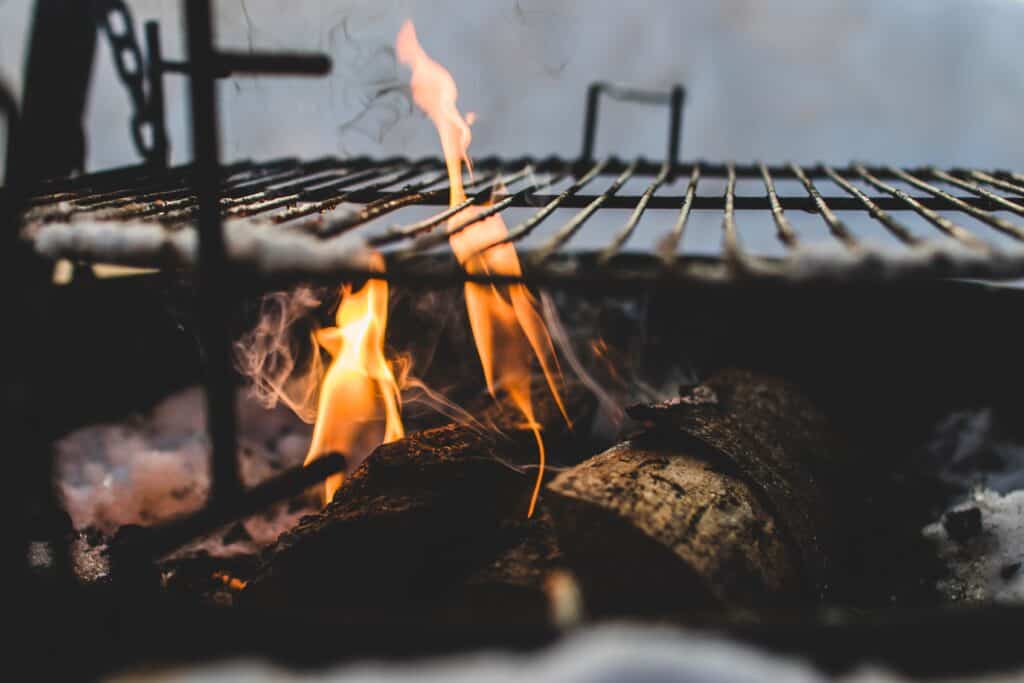 Flames beneath a grill rack