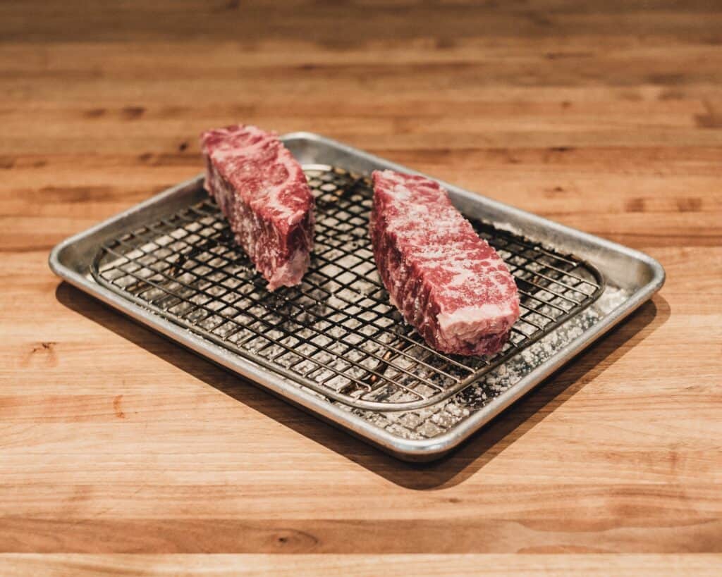 Wagyu steak resting on pan